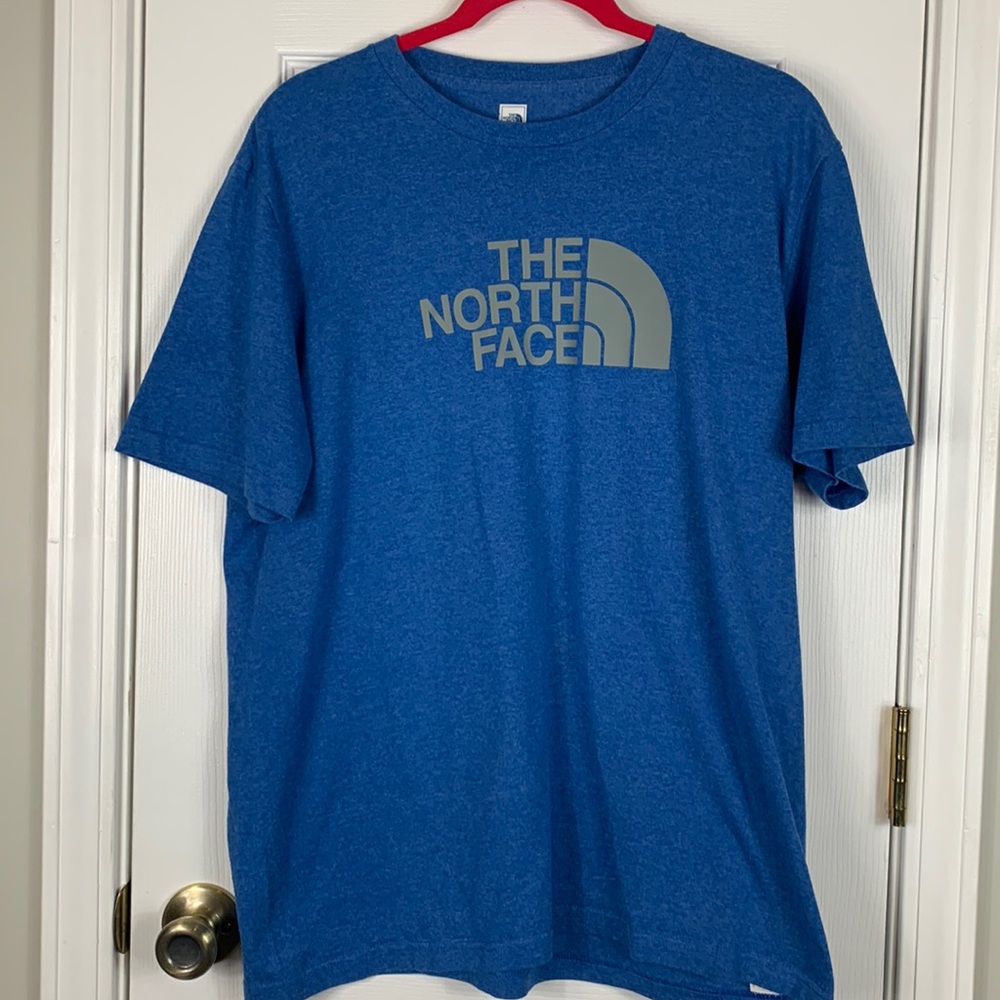 The North Face Heather blue short sleeved tee shirt size large. Grey lettering